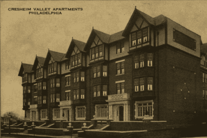 An old postcard of an apartment building designed in a Tudor Revival style with Classical Revival details for emphasis around three entrances on the facade.