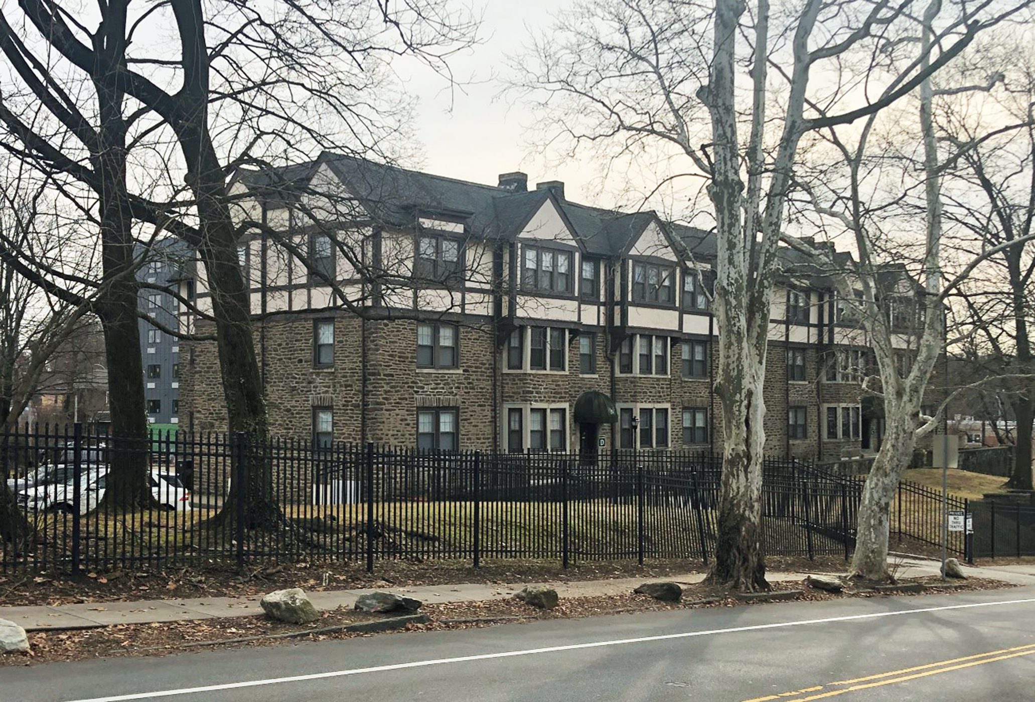 The Wood Norton Residences, and apartment building with a stone base and English Tudor style upper floors.